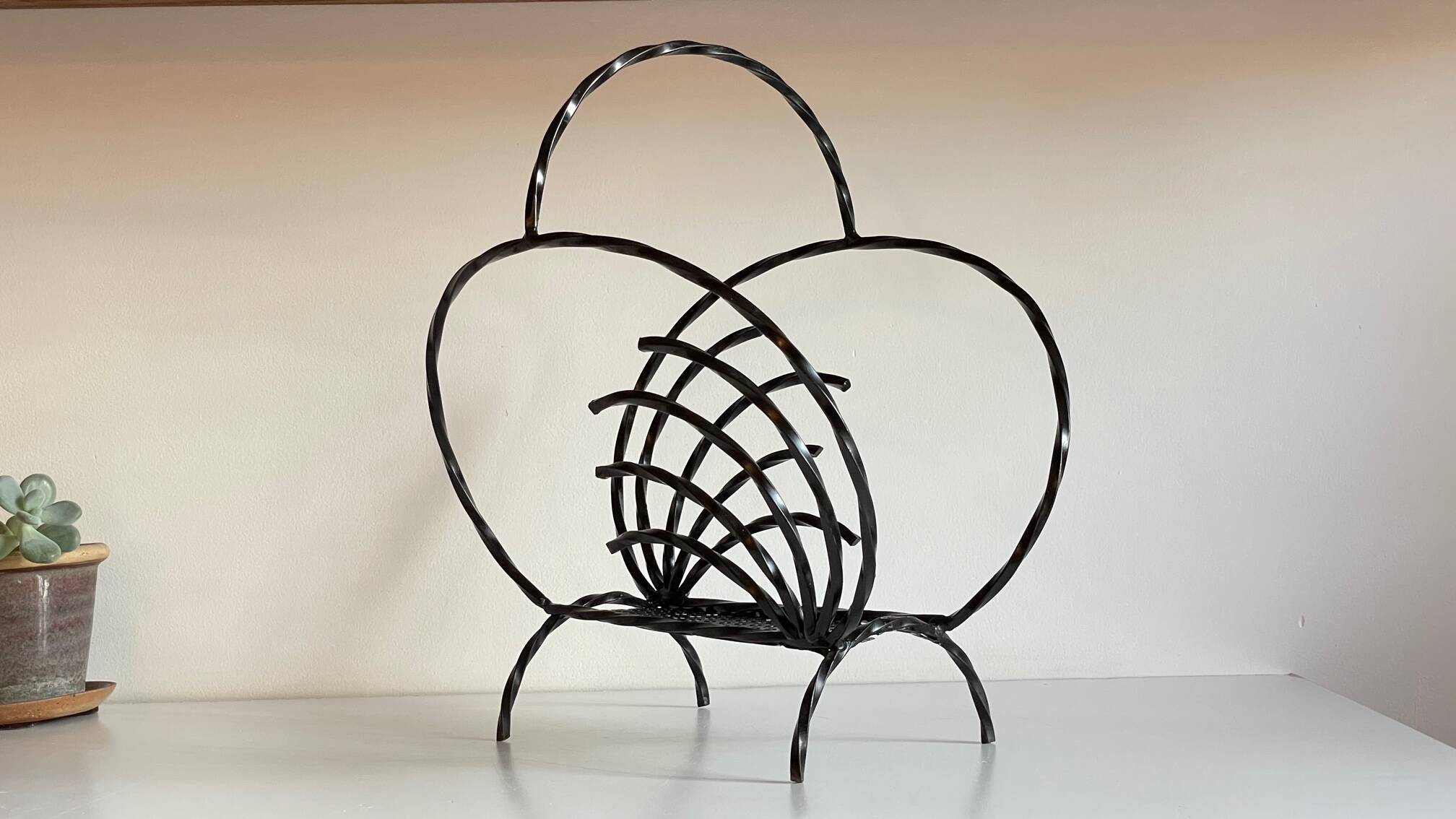Vintage steel and rigitulle magazine holder