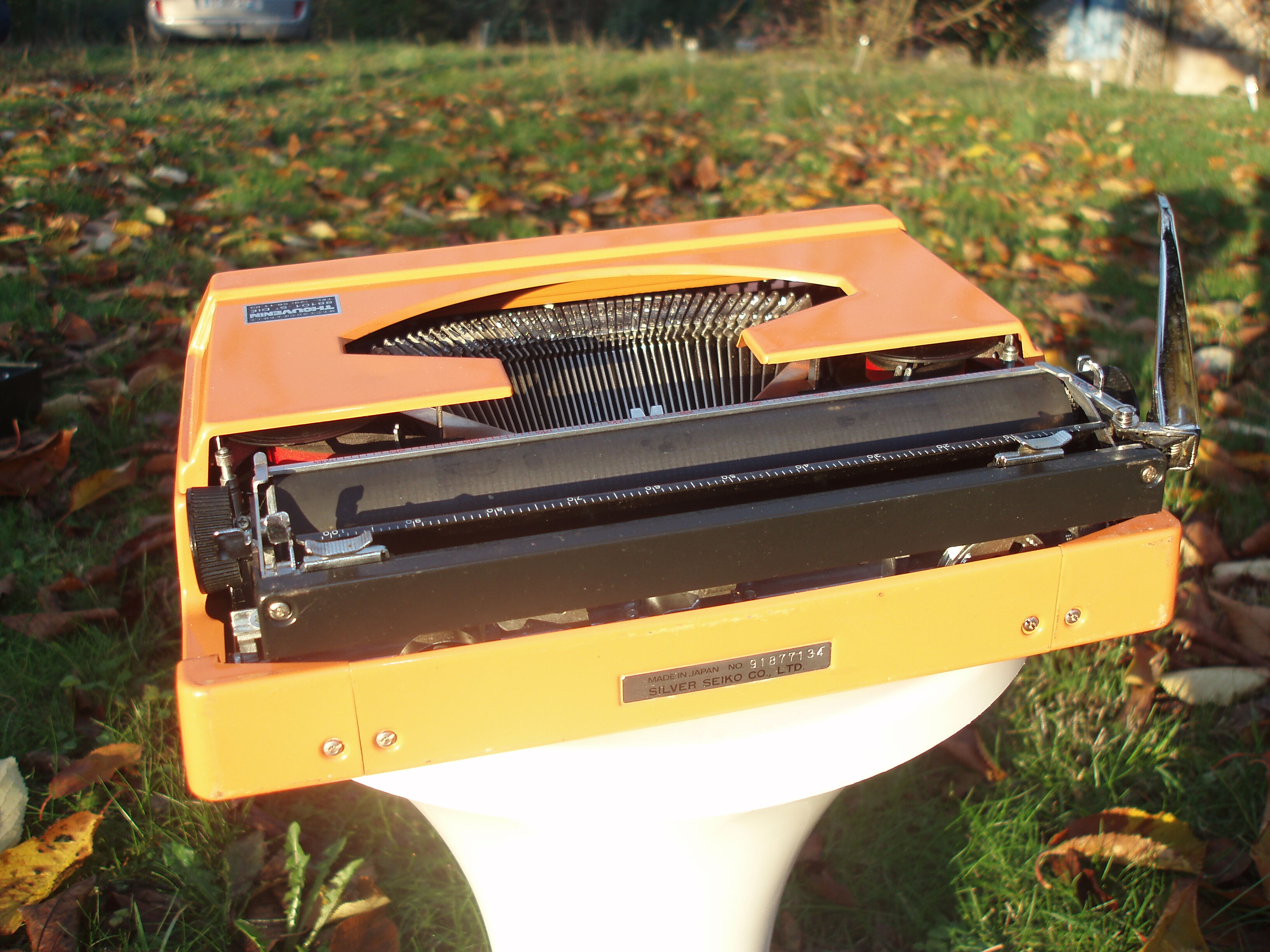 Silver reed orange and black typewriter with bag
