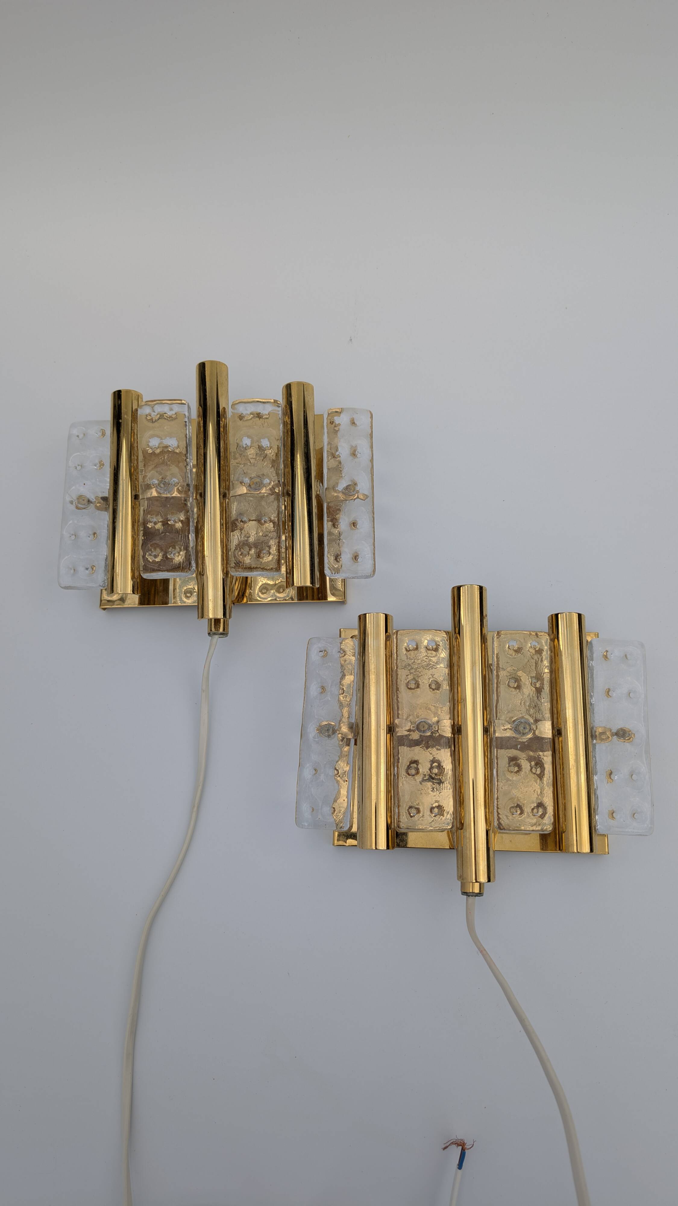 Pair of Hans-Agne Jakobsson wall lights in brass and pressed glass