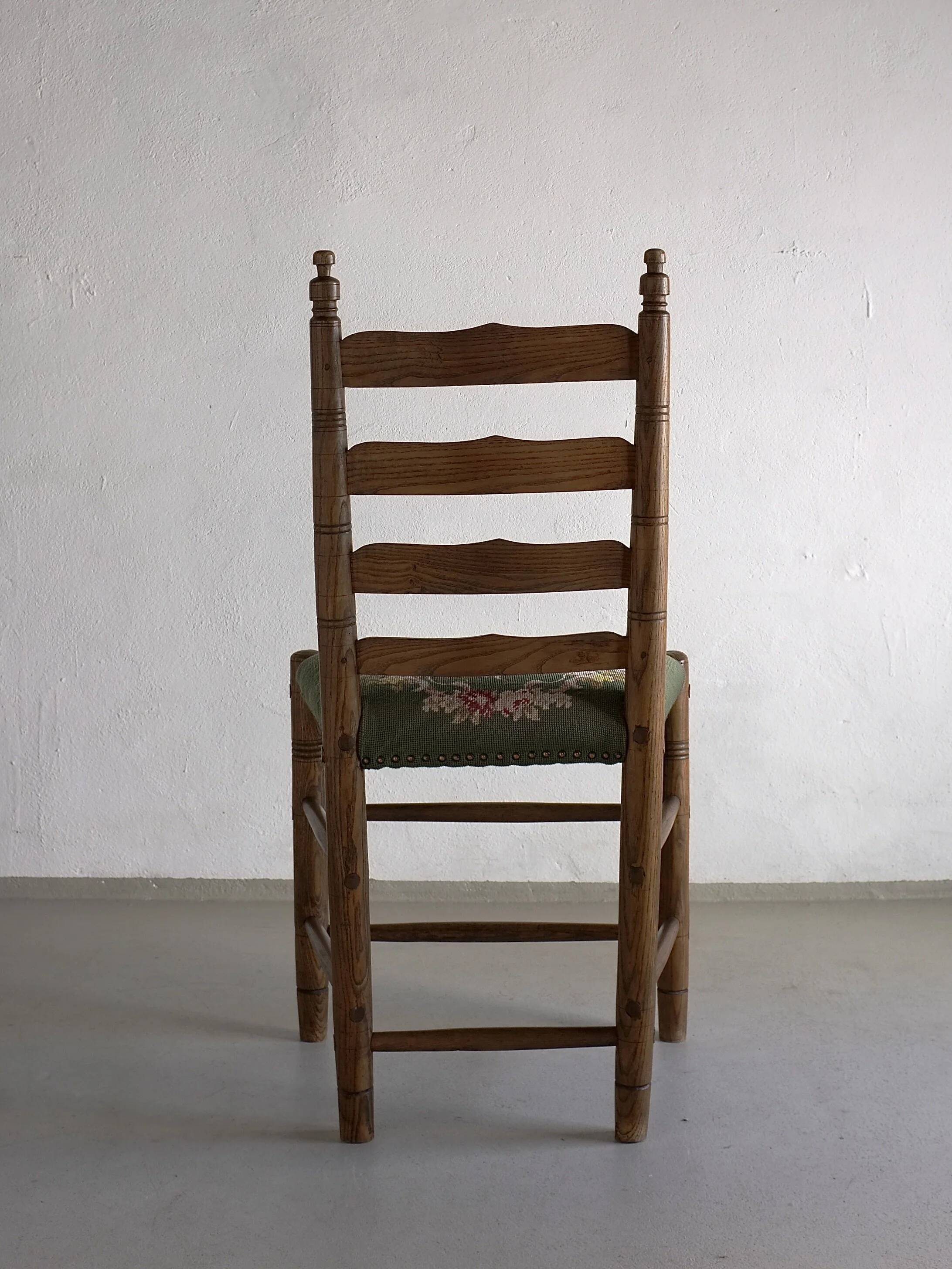 Rustic ladder-back oak chairs with embroidered seats | Netherlands | 1950s