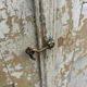 Small antique wardrobe with a faded white patina.