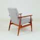 Armchair with striped fabric footrest, 1960