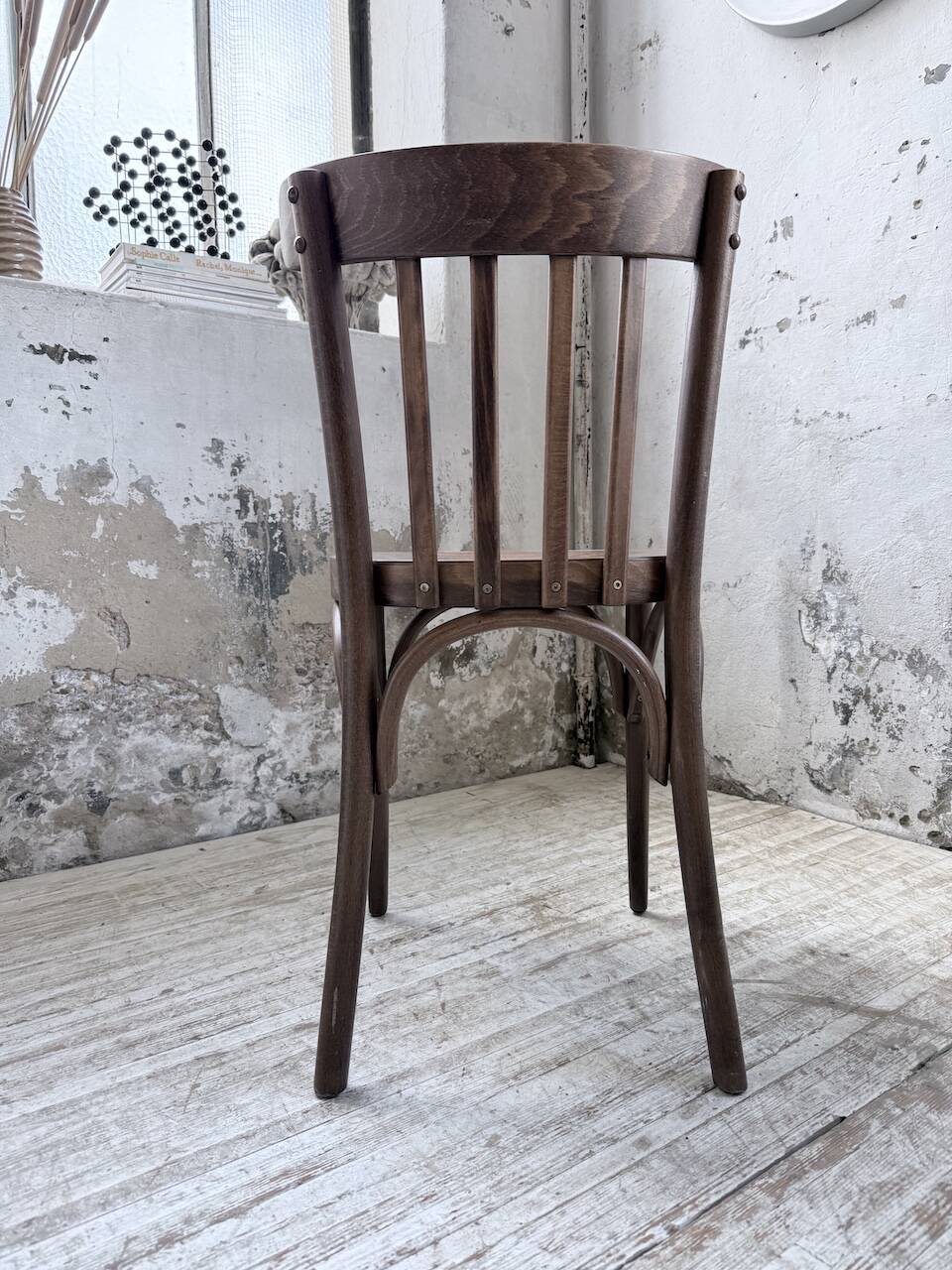 Set of 14 walnut bistro chairs.