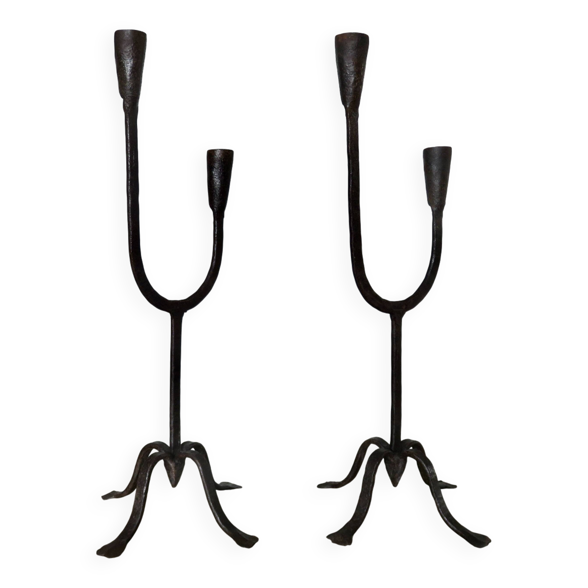 Pair of antique wrought iron candlesticks