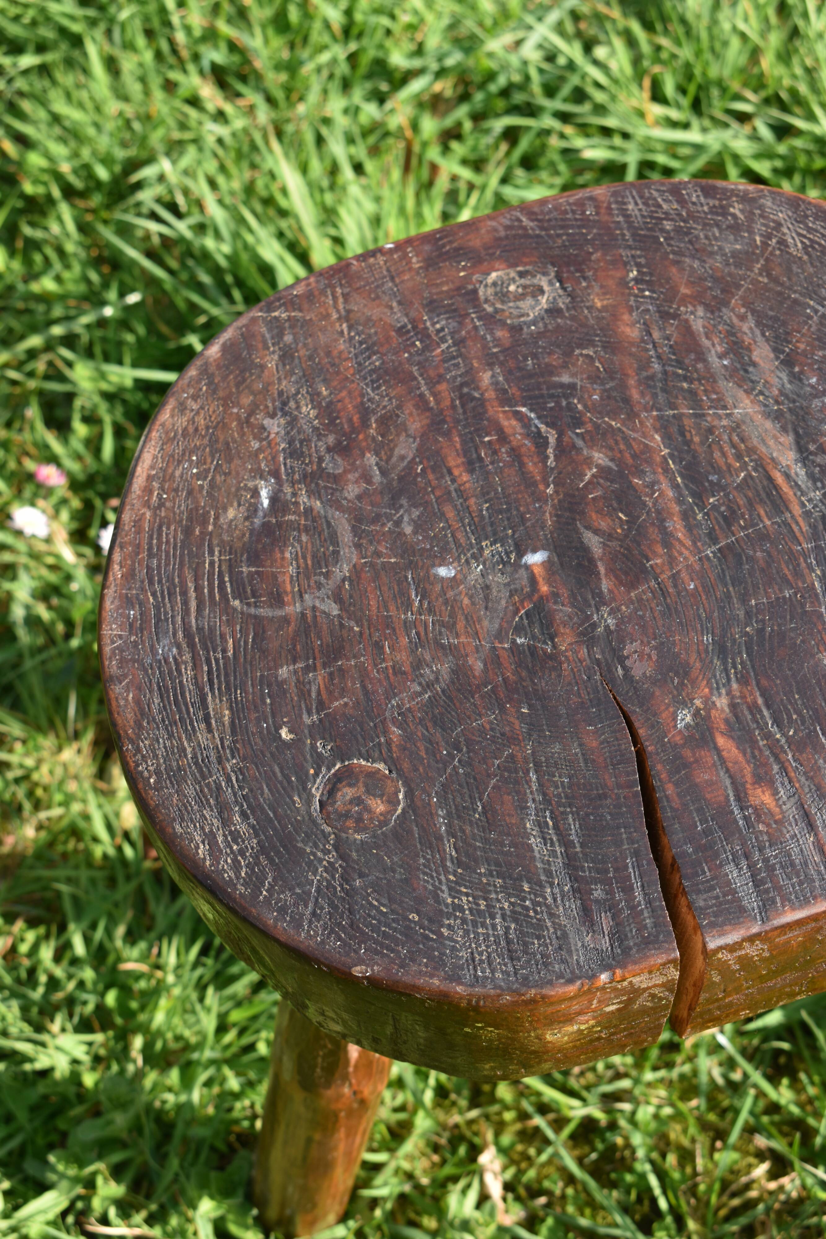 Ancient tripod brutalist stool