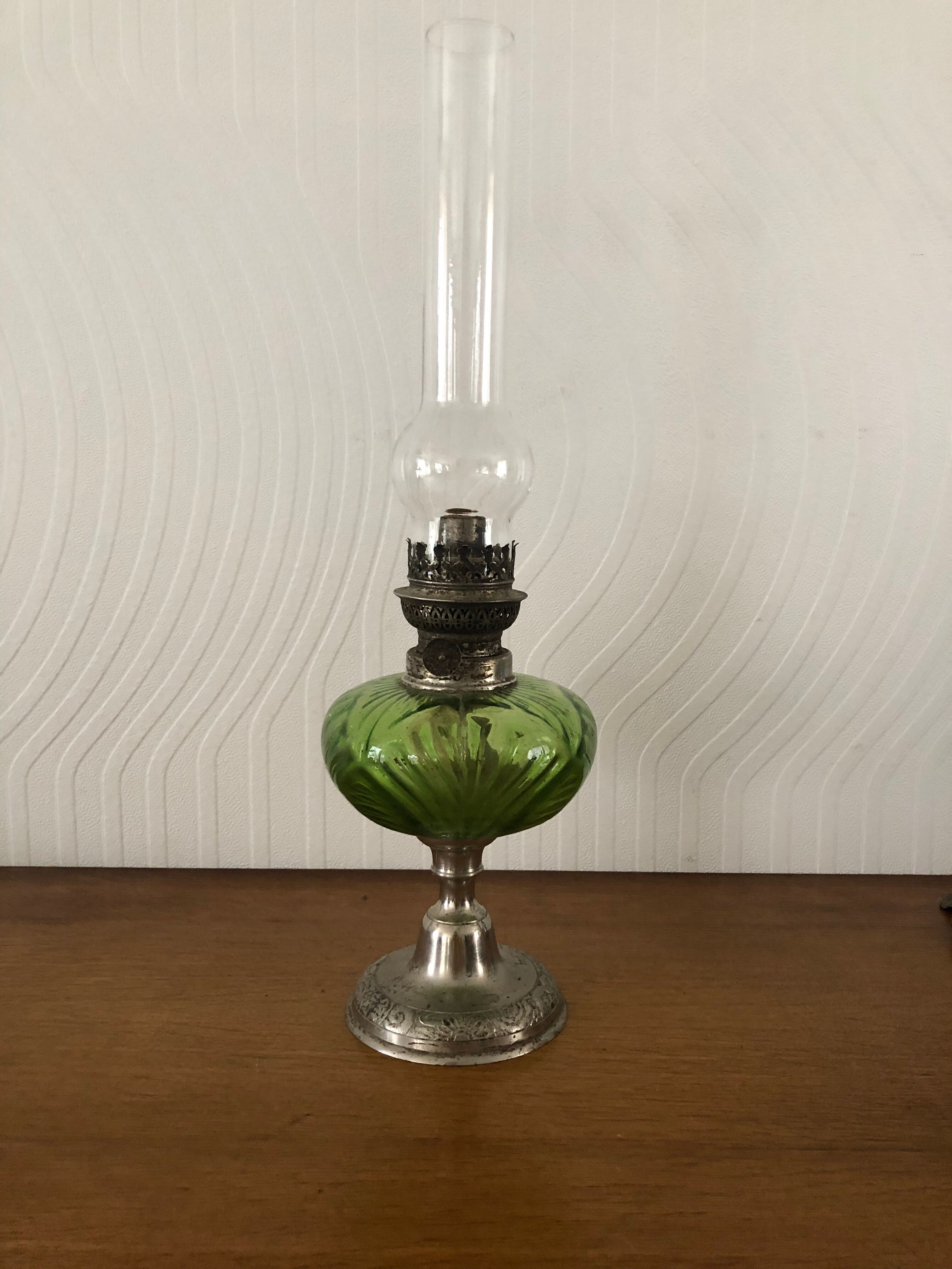 Antique oil lamp in glass and metal