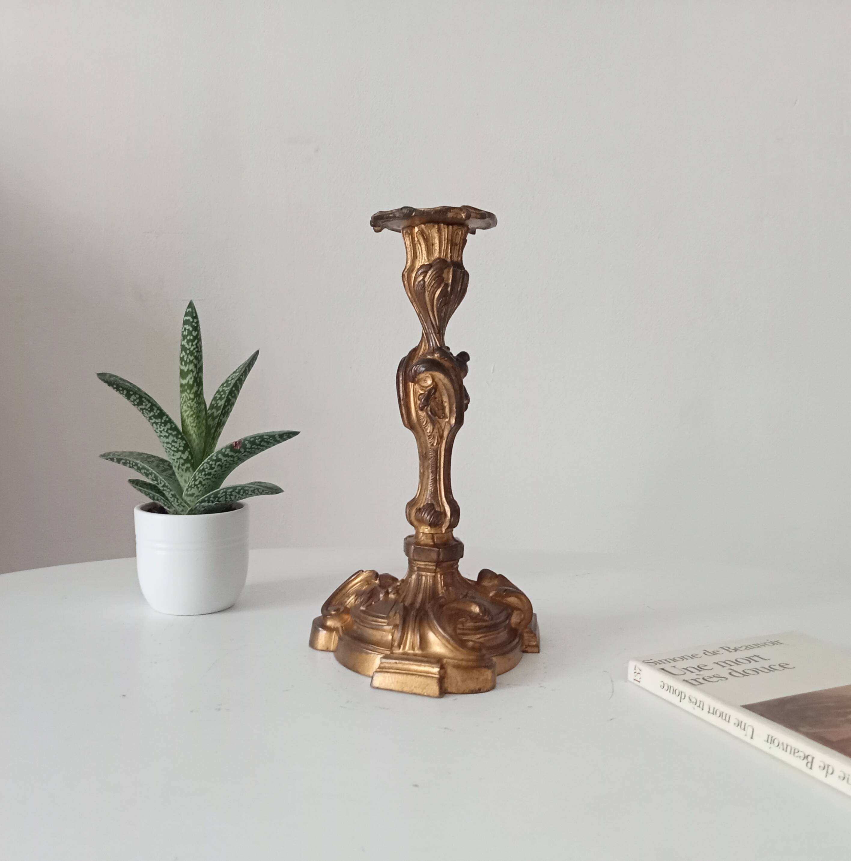 Antique 19th-century solid gilded bronze candlestick in the Louis XV style.