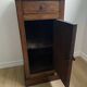 Vintage bedside table in the shape of a wooden column and a gray marble top