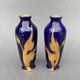 Pair of 1900 Limoges vases with blue background and gold highlights, R. Rosier decorations