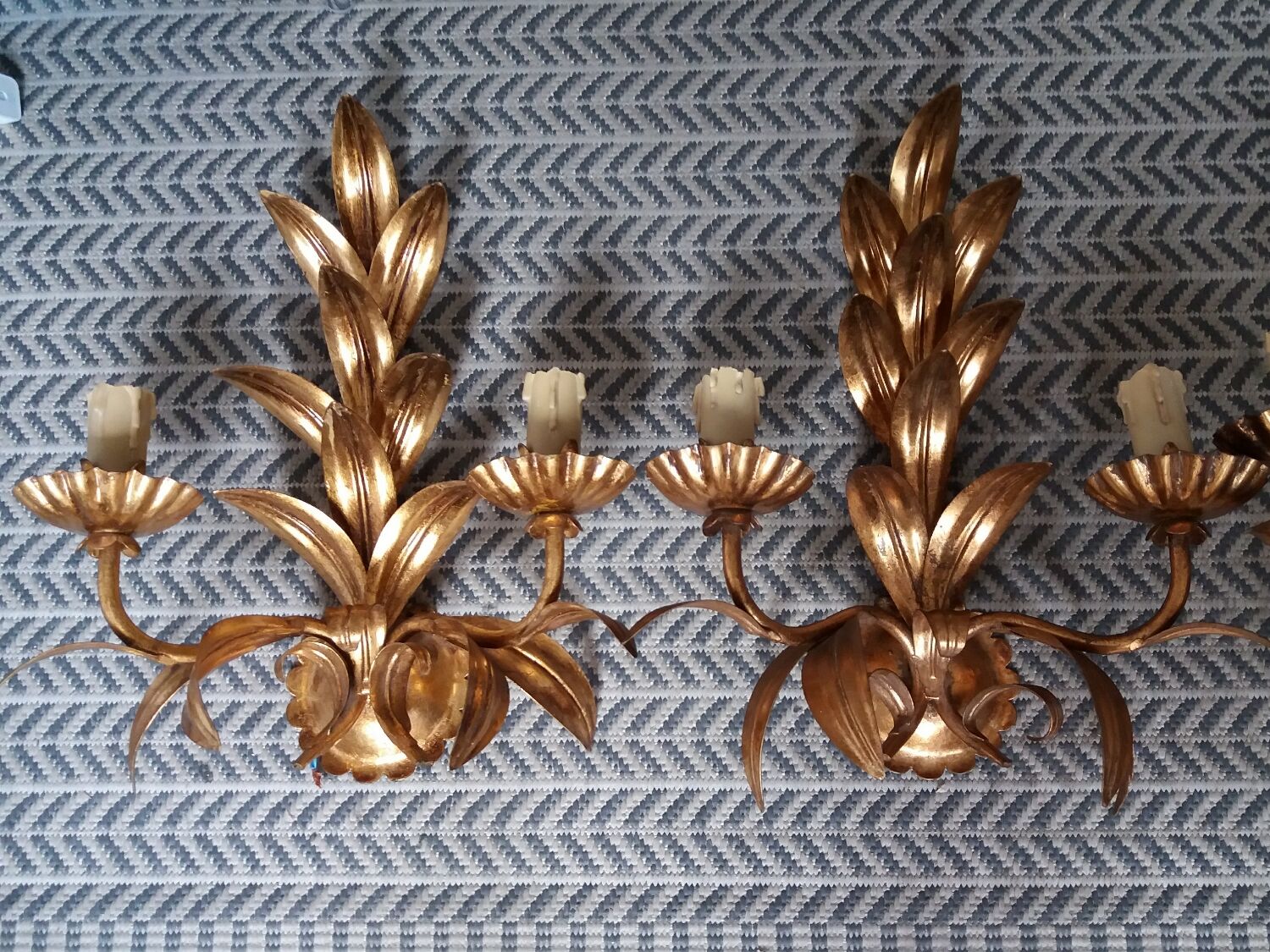 Pair of vintage golden sheet metal wall lights with leaf decoration