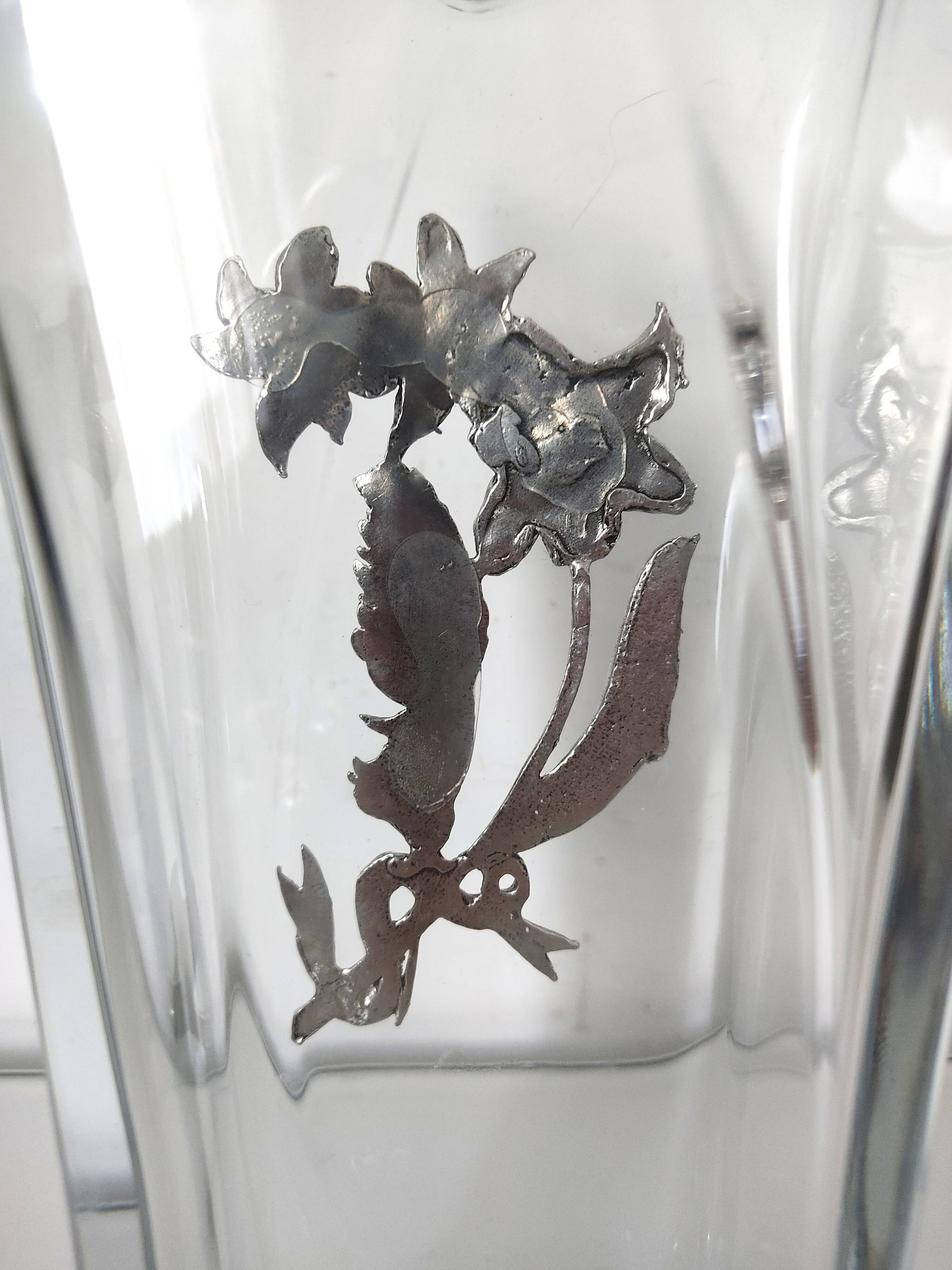 Glass vase with metal flower application