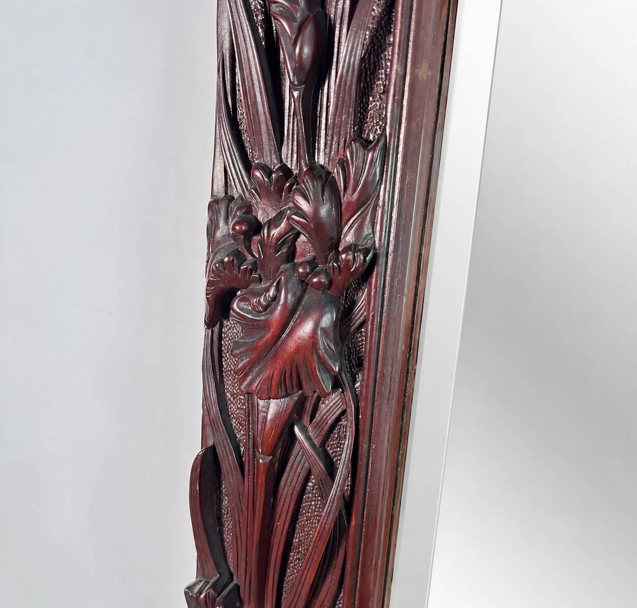 Large mirror (2 metres) Art Nouveau in carved mahogany with high-relief decoration.