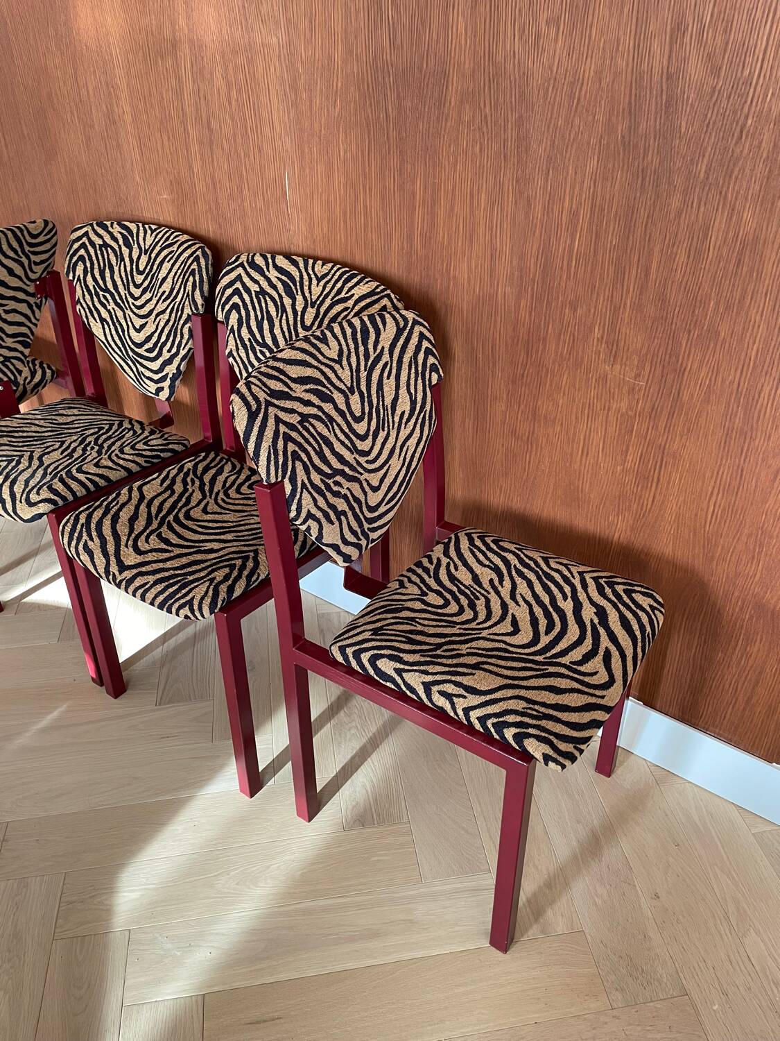 4 red lacquered zebra chairs