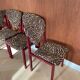 4 red lacquered zebra chairs