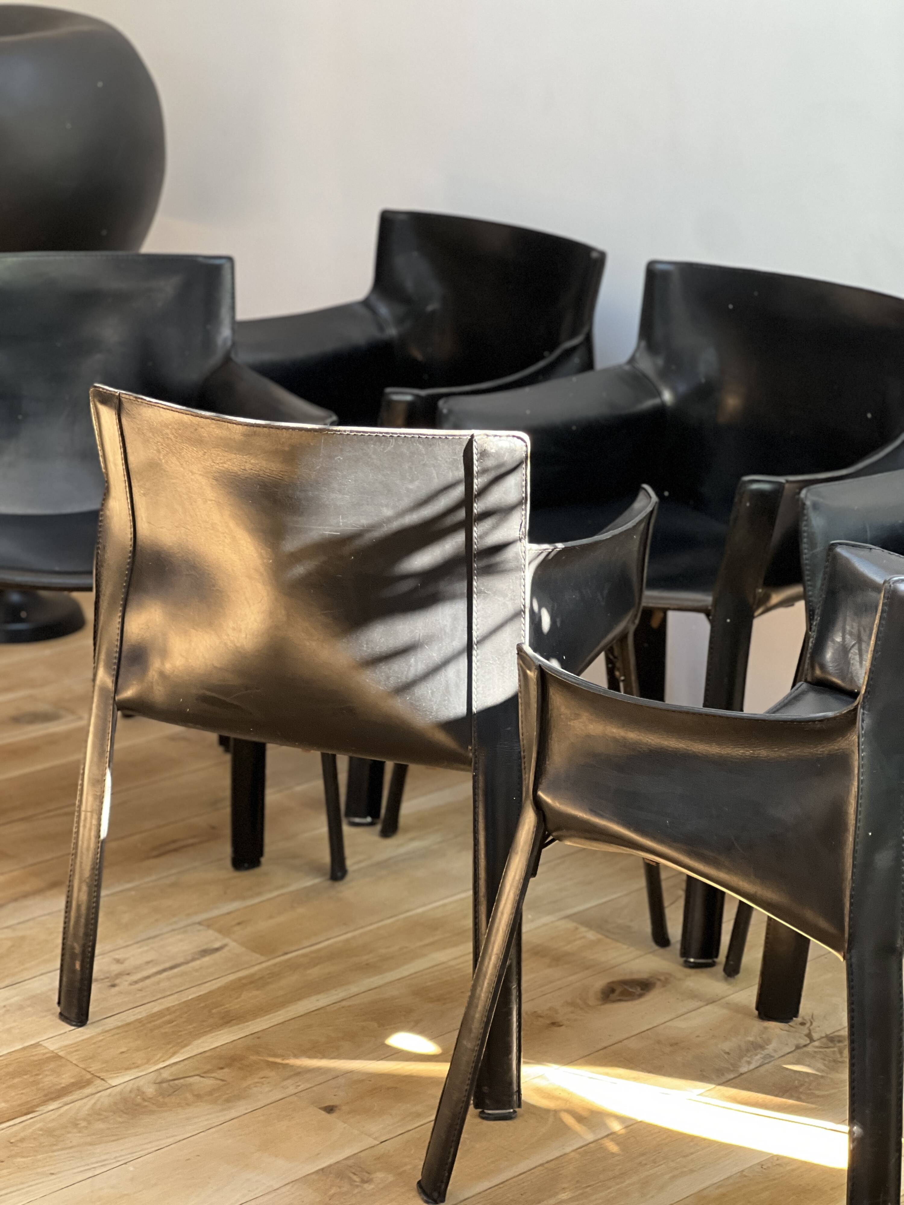 Set of 6 black leather armchairs from the 1970s