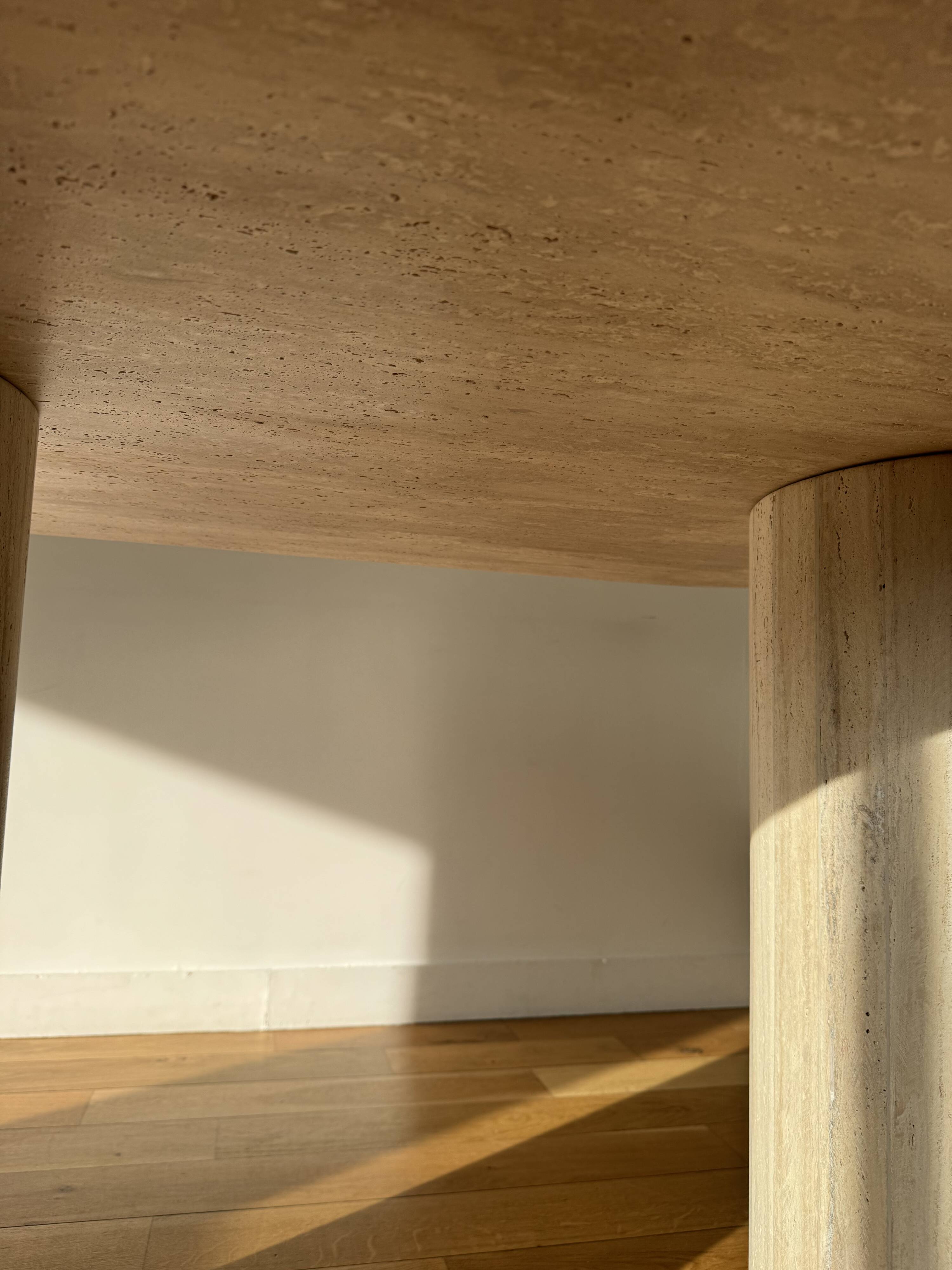 Dining table in natural travertine.