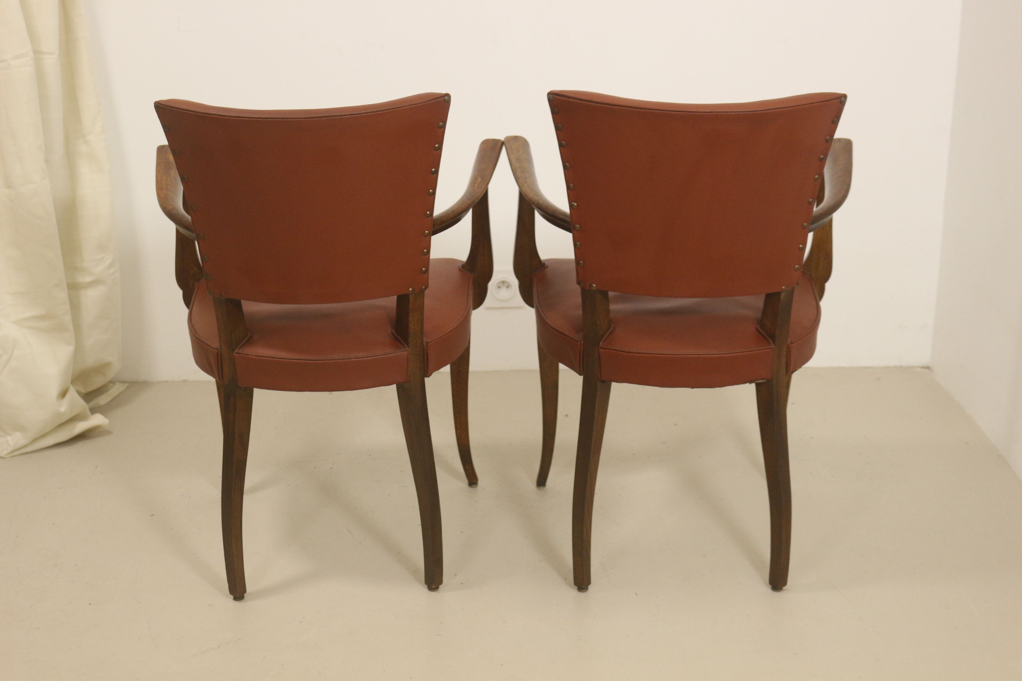 Pair of vintage bridge armchairs year 60 in imitation rust leather.