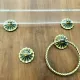 Vintage lucite and brass shelf with its hooks.