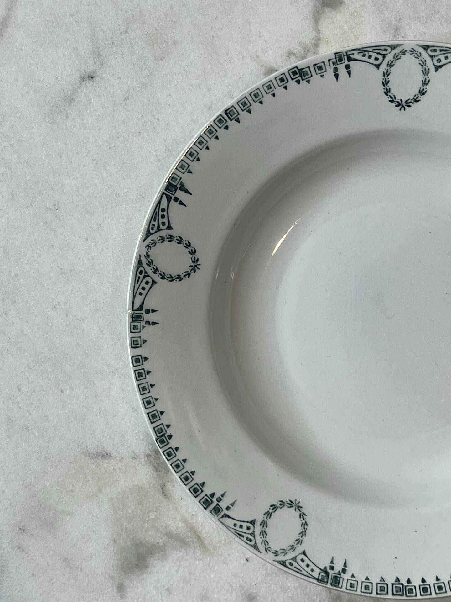 Set of 4 deep plates from Saint Amand with laurel wreath decoration.