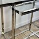 Chrome metal and glass console from the 2000s.