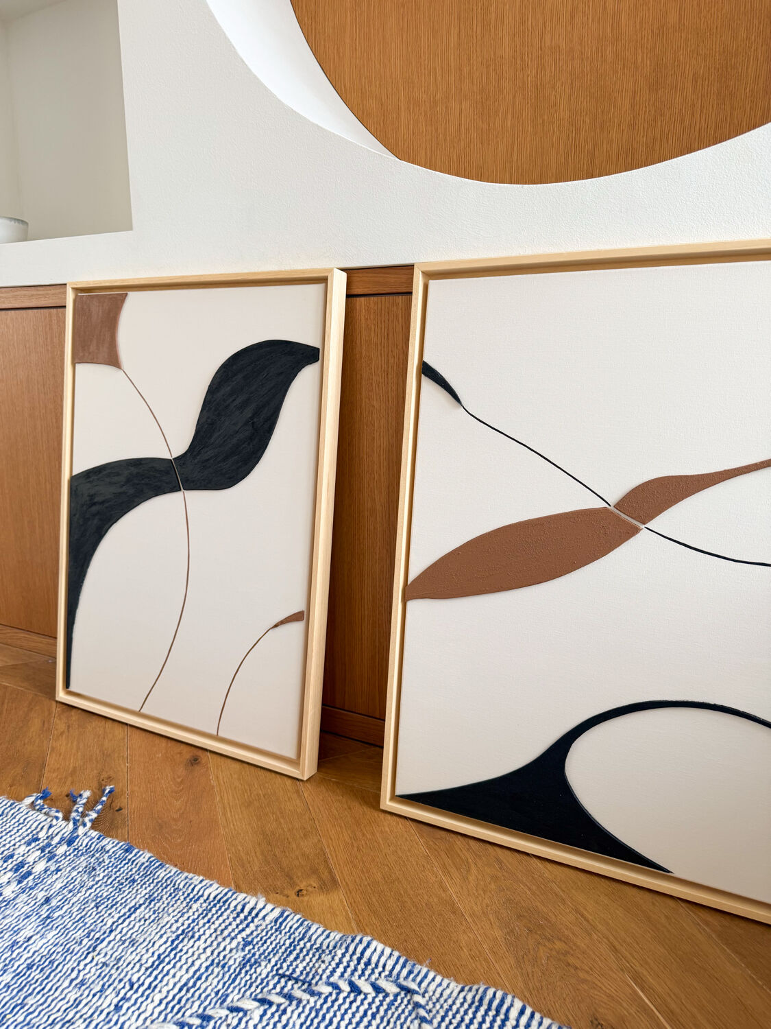 Beige, black, brown diptych design panels.