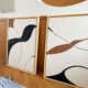 Beige, black, brown diptych design panels.