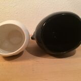 2 black and white ceramic head vases, face