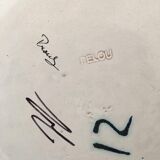 Glazed ceramic plate representation man between two lands unknown signature