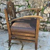 Pair of armchairs in stained wood and leather, 20th century