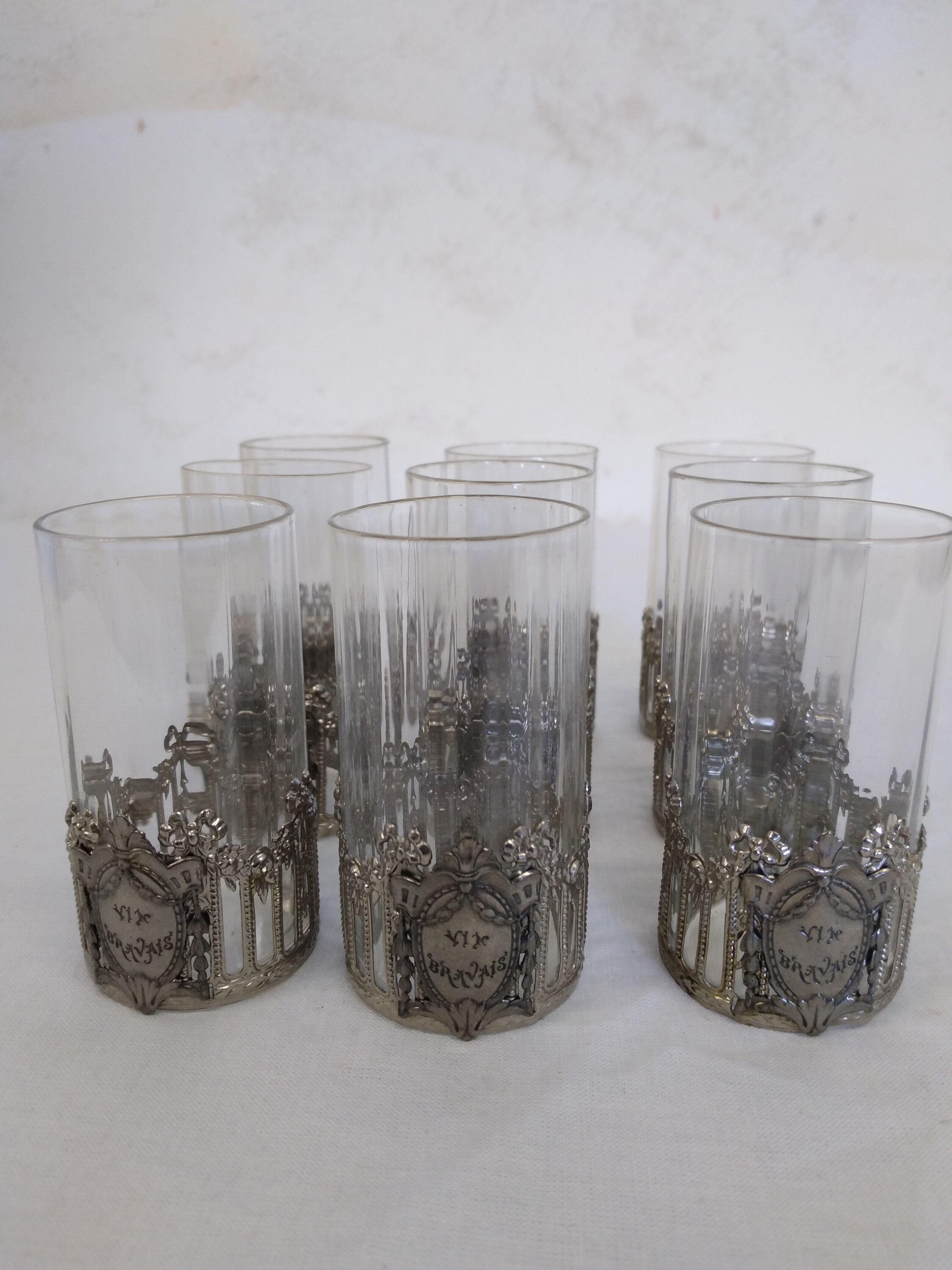 Glass with art deco strapping