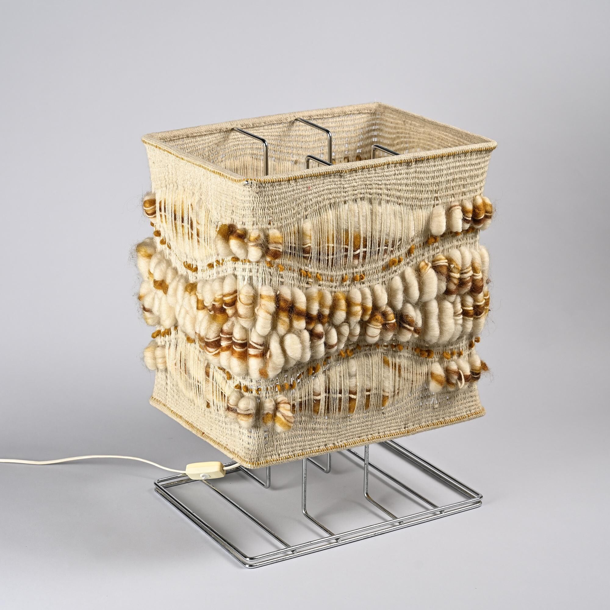 Woven textile and chrome metal table lamp by Max Sauze, circa 1970.
