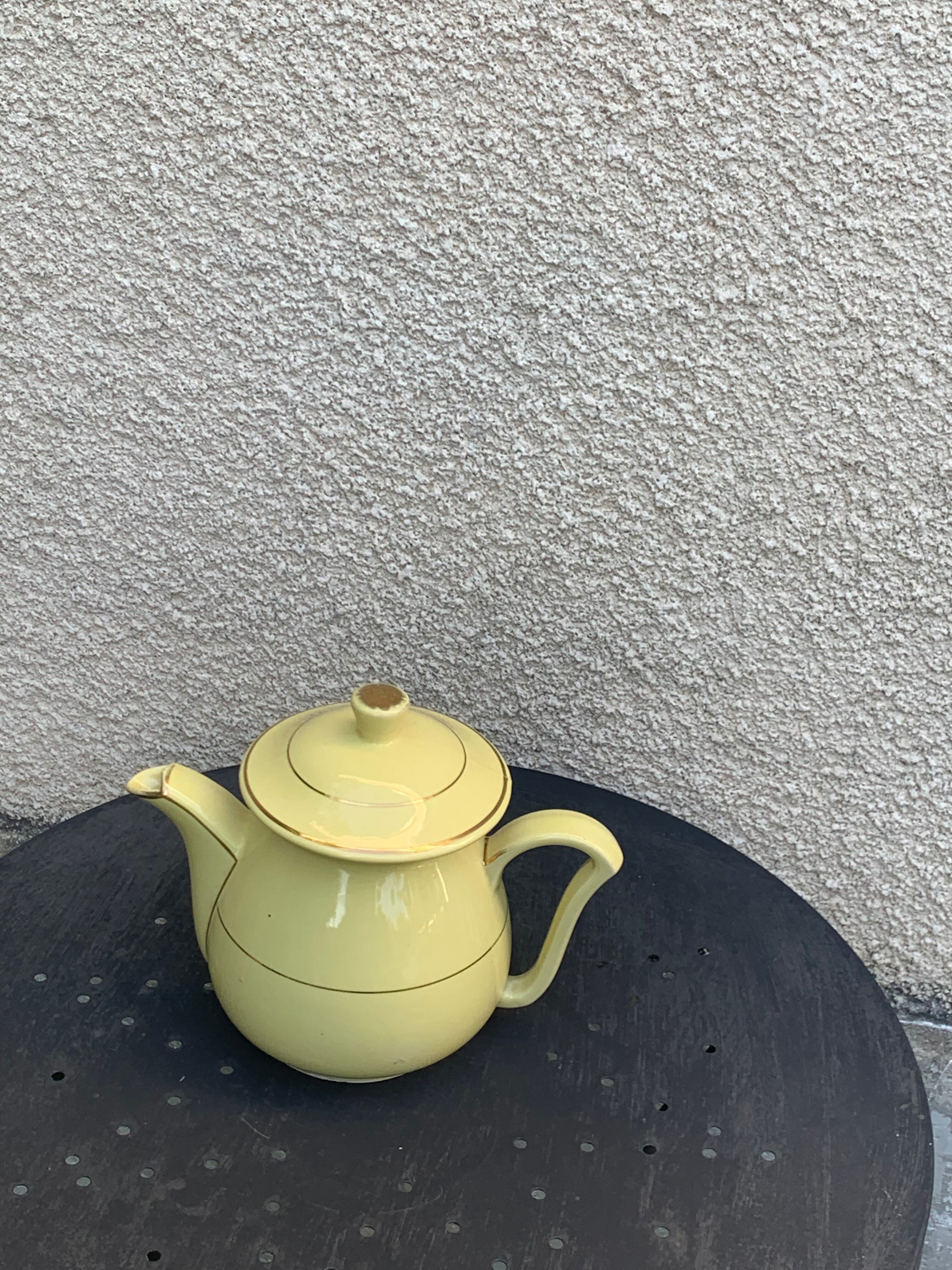 Teapot, yellow earthenware coffee maker and vintage gold edging