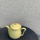 Teapot, yellow earthenware coffee maker and vintage gold edging