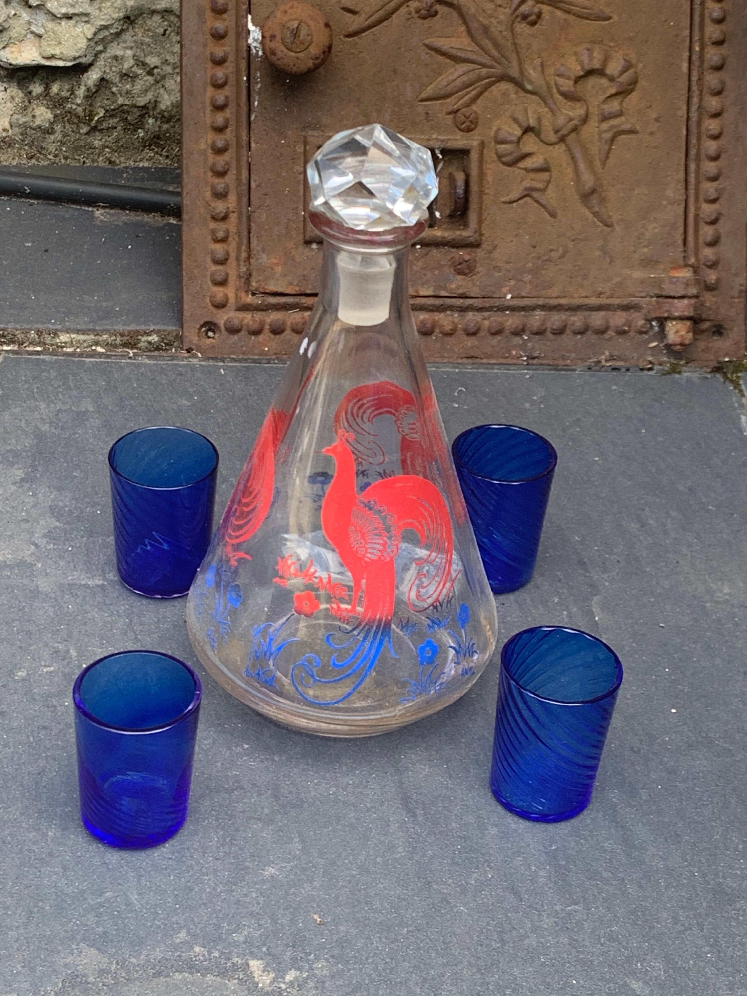 Peacock pattern liqueur decanter and 4 small vintage cobalt blue glasses