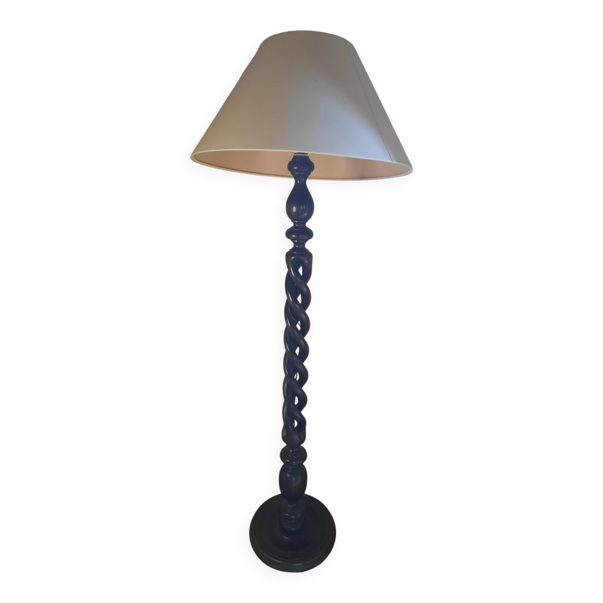 Sculptural floor lamp made of twisted turned wood.