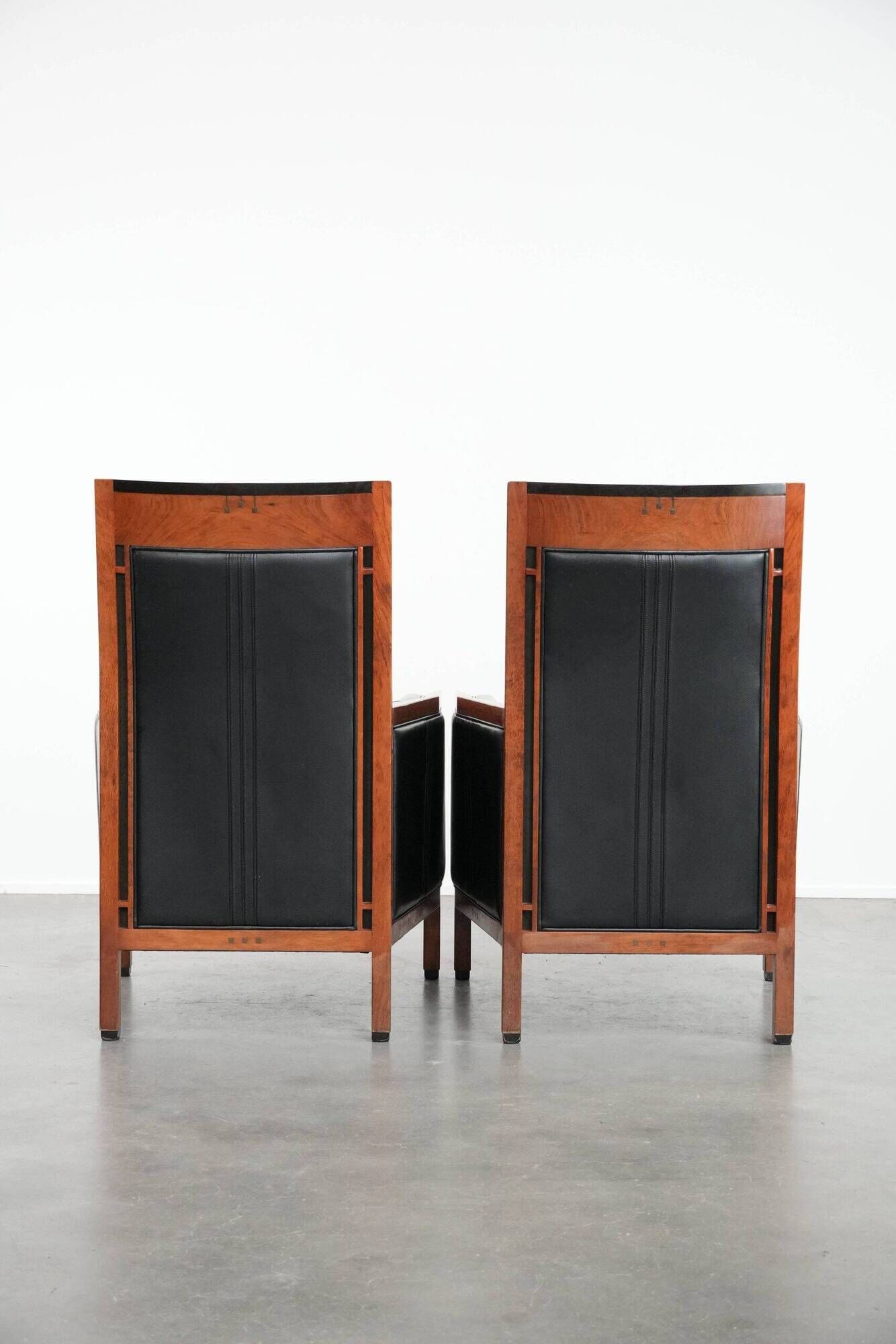 Beautiful set of 2 black cow leather Art Deco design armchairs with high back