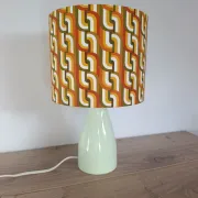 Seventies spirit lamp with geometric orange/green lampshade.