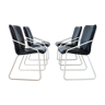 Série de 4 chaises en cuir, piétement traineau laqué blanc