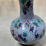 CHINA Polychrome porcelain vase decorated with butterflies Signed under the base 43cm