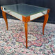 Small wooden coffee table with a mirror from the 1950s.