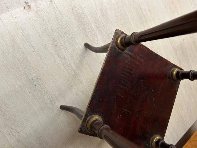 Wooden and brass saddle