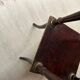 Wooden and brass saddle