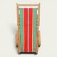 Vintage deck chair with striped green and red fabric, original patina.