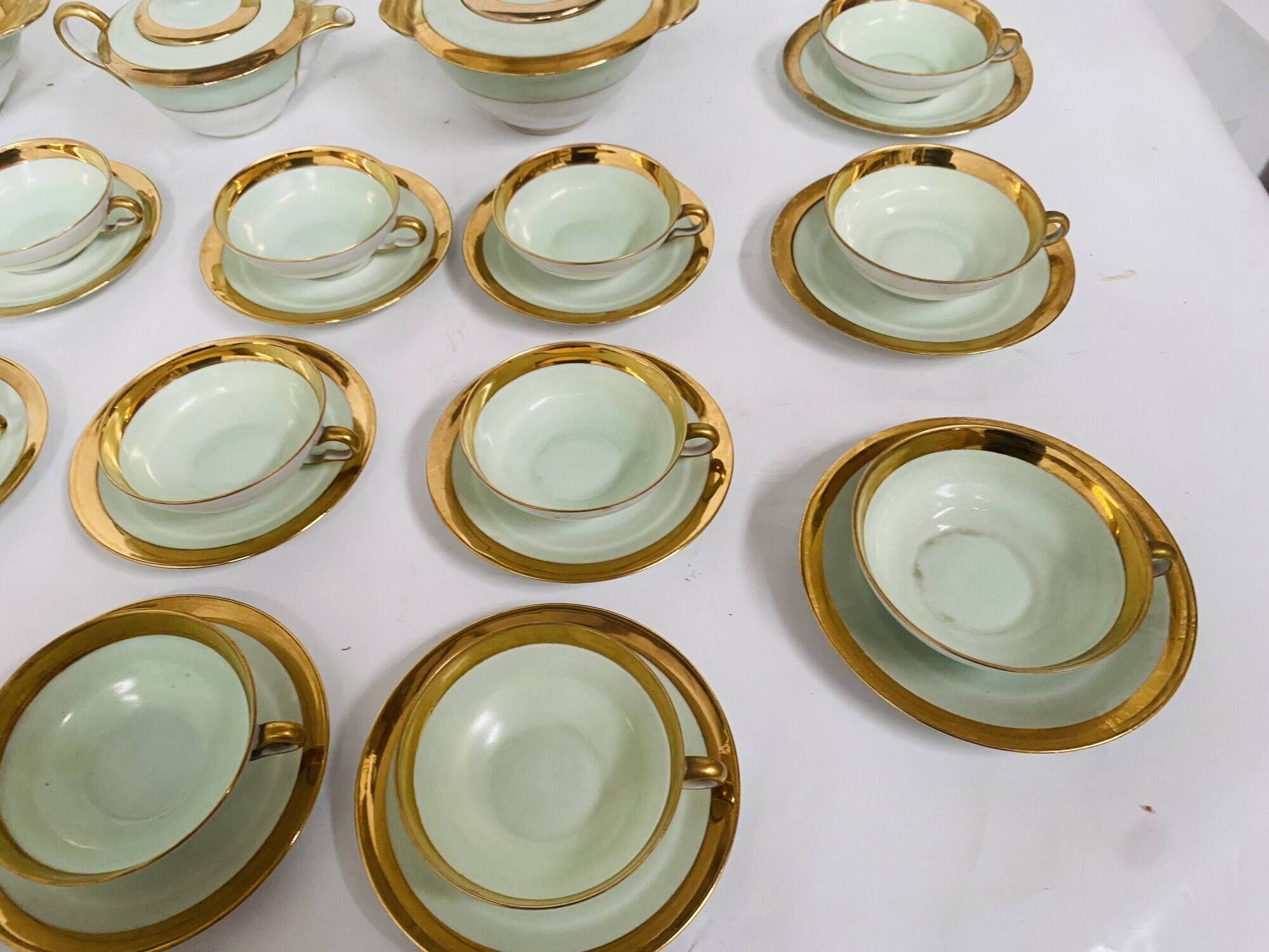 Coffee and tea service comprising 25 pieces in polychrome porcelain. 20th century.