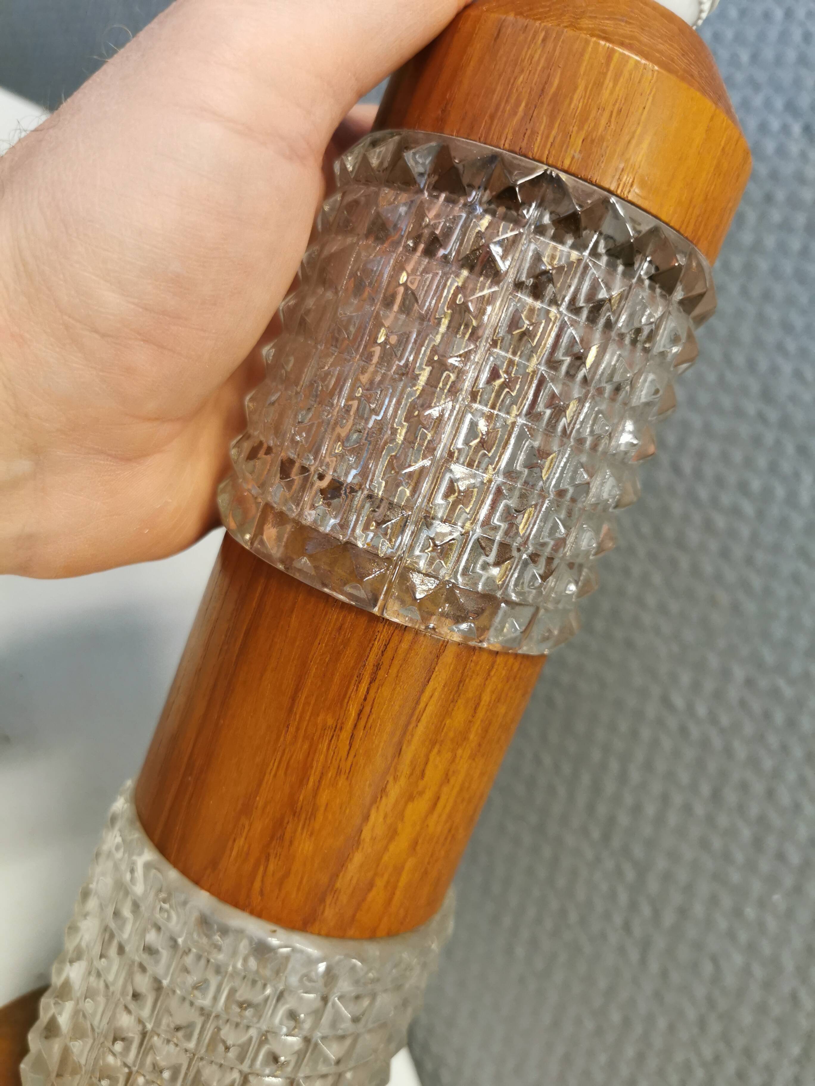 Swedish table lamps made of teak wood and hard pressed crystal glass.