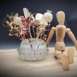 Pique flowers in glass of Reims