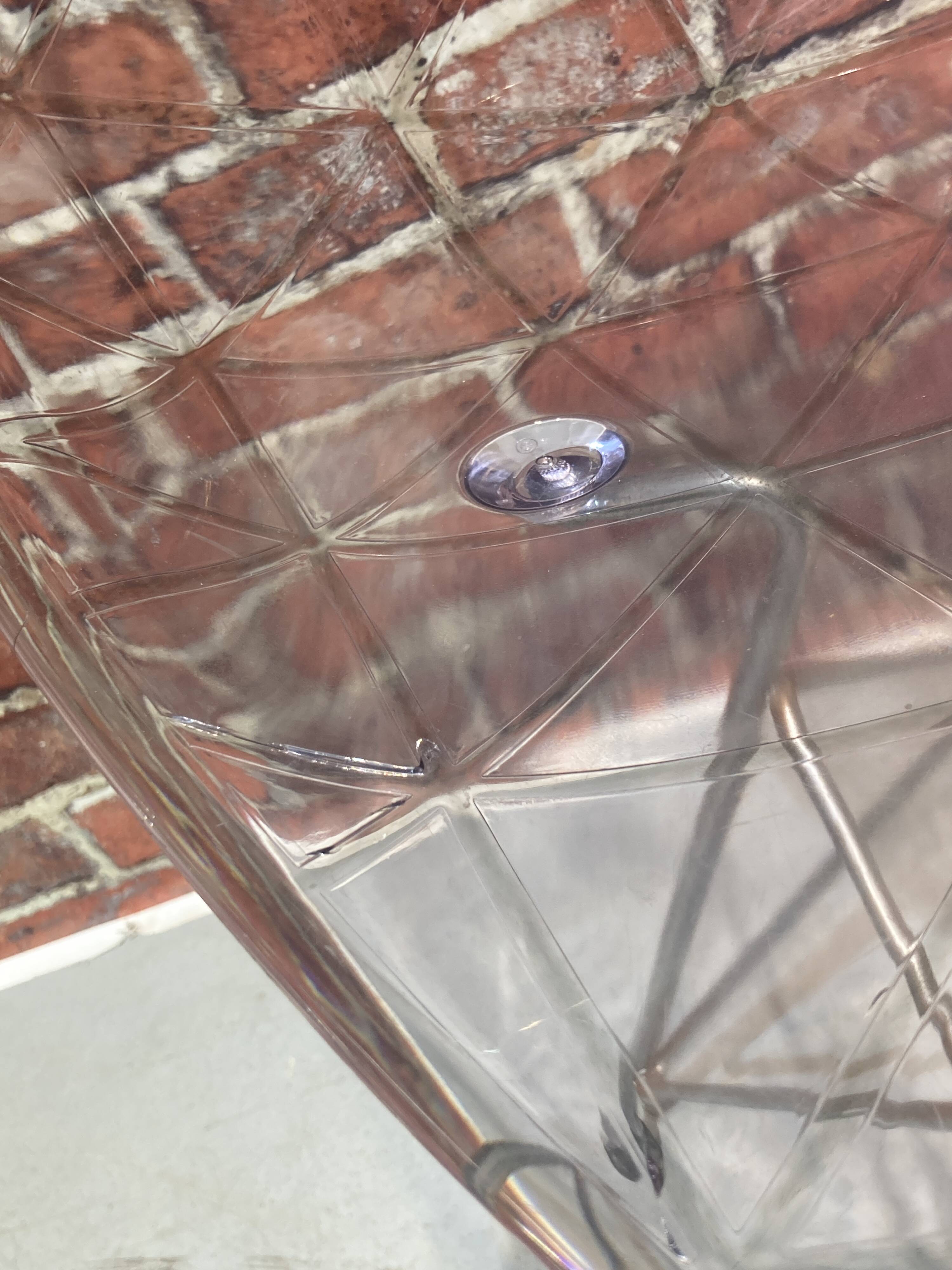 Set of four plexiglass and metal chairs