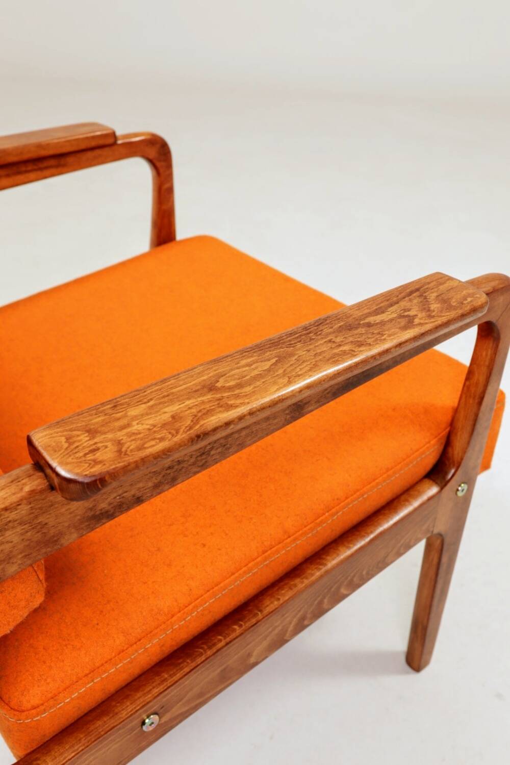 Vintage armchair in papaya orange wool from the 1960s.