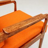 Vintage armchair in papaya orange wool from the 1960s.