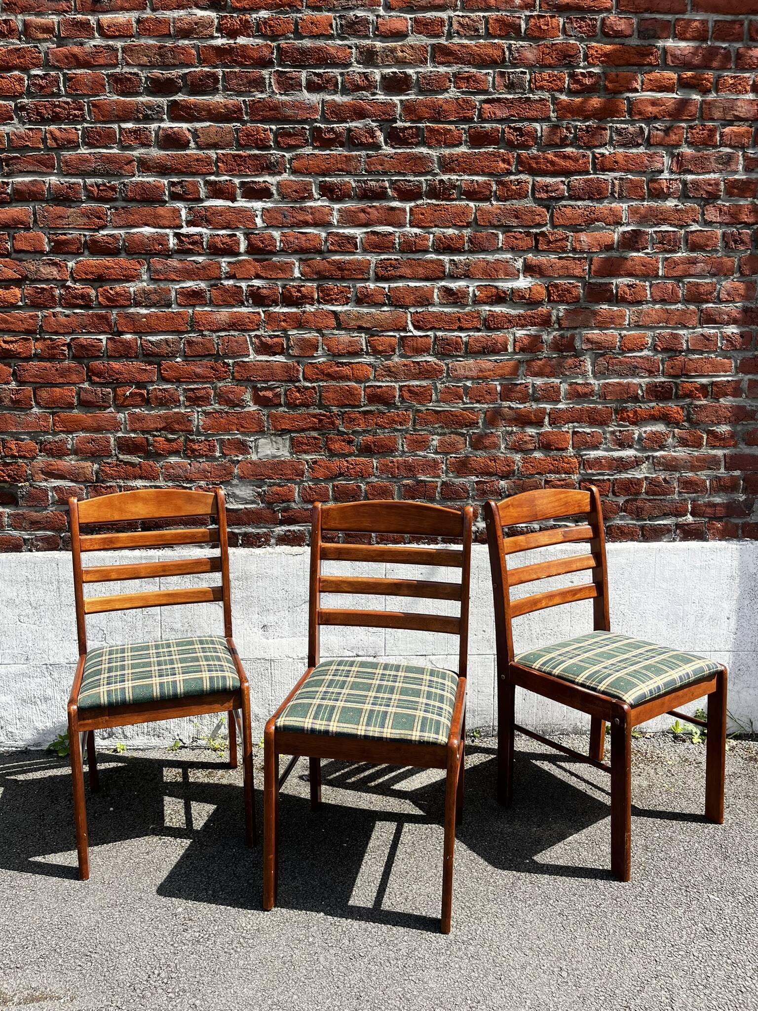 Lot of 3 vintage checkered wood and fabric chairs.